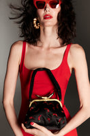 Black Bella shoulder bag by Sarah's Bag featuring chili on sizzling design, stylish and spacious for daily use.