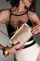 Silver chili straw clutch bag by Sarah's Bag featuring a sleek, metallic design with a chili motif for a stylish accessory.