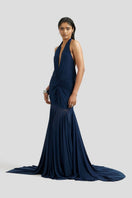 Navy blue Chloe maxi dress by Deme By Gabriella, flowing fabric with a fitted waist and elegant design, shown on a model.