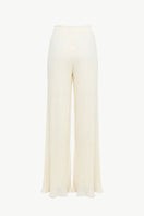 Off-white Choza Plisse Pants by Maylé Vásquez, showcasing lightweight, pleated fabric with a relaxed fit and stylish design.