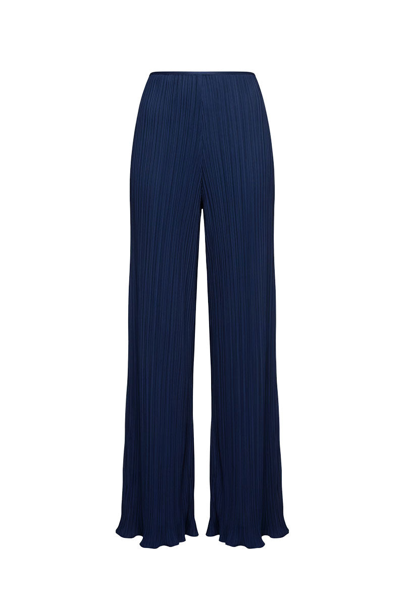 Maylé Vásquez Choza wide leg pants in midnight blue, featuring a relaxed fit and flowing fabric, displayed on a hanger.