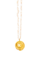 Gold cinnamon roll-shaped pendant necklace by Oz Objects, featuring a detailed and stylish design.