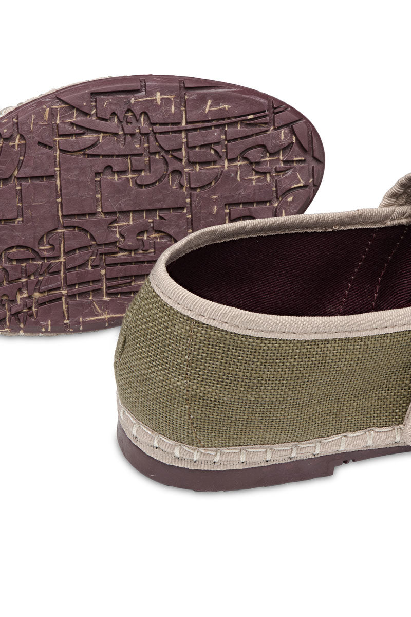 Pair of Flabelus Claire green flats with rounded toe and slip-on design, featuring a soft fabric upper and comfortable flat sole.