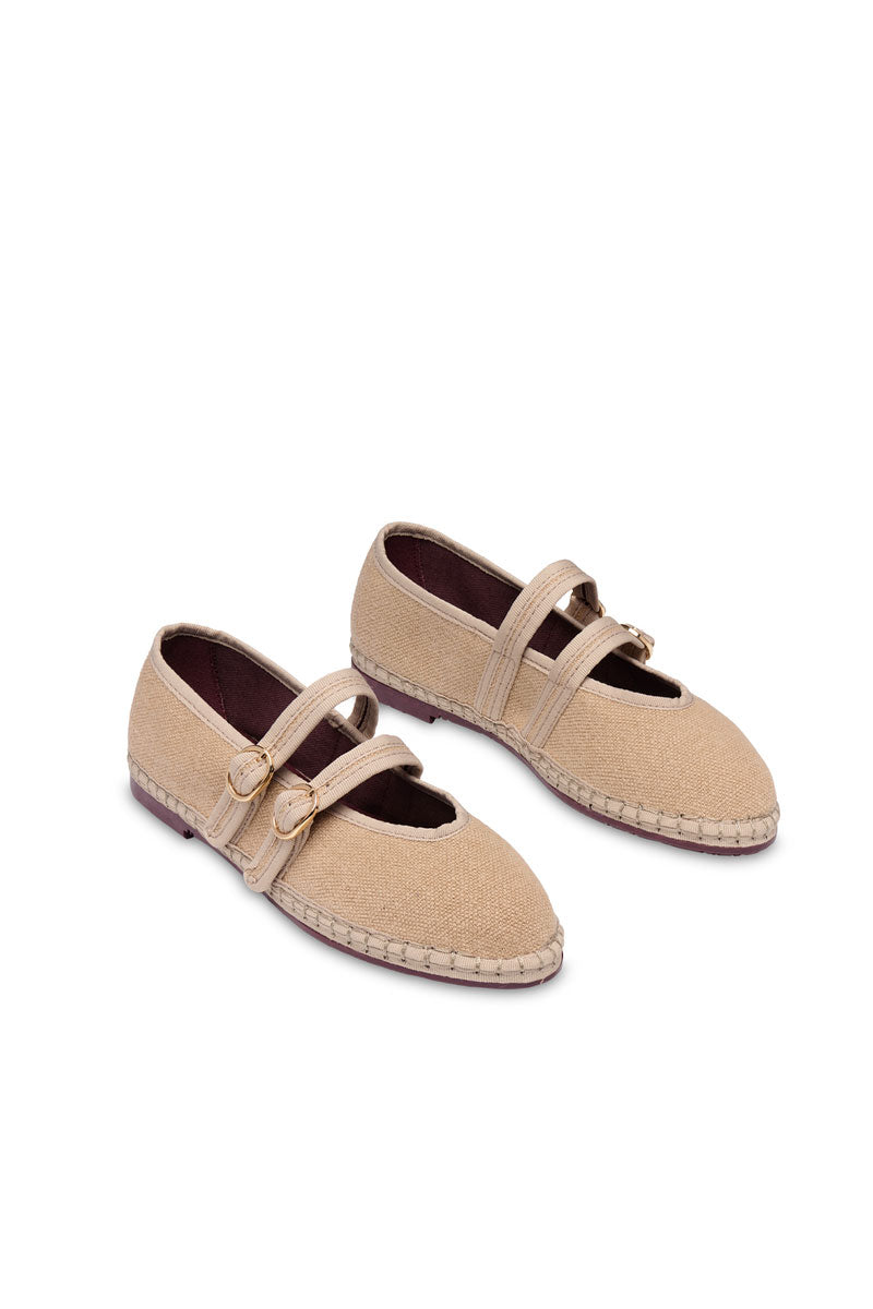 Flabelus Claire Sand flats with open toe design and ankle strap, featuring a comfortable flat sole in beige sand color.