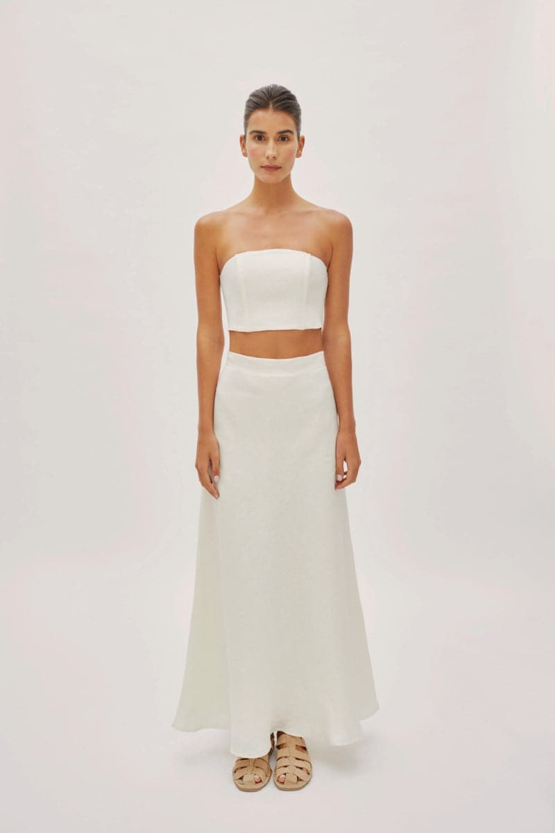 Ecru linen Clara maxi skirt by Labeca featuring a flowing design and bandeau waist, perfect for casual or summer wear.