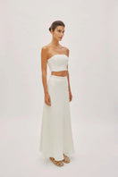 Ecru linen Clara maxi skirt by Labeca featuring a flowing design and bandeau waistband, perfect for casual summer wear.