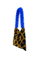 Sac de Soul Clash of Prints gold, black, and blue shoulder bag with bold design and adjustable strap, shown from side view.