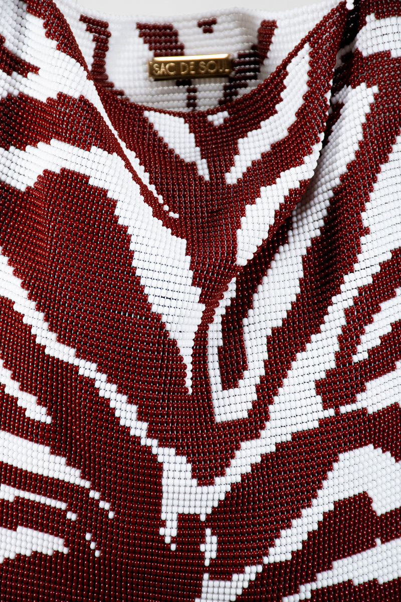 Close-up of SAC DE SOUL Clash of Prints zebra brown and white shoulder bag highlighting the animal print design and textured material.