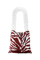 Brown and white zebra print shoulder bag by SAC DE SOUL featuring a stylish, patterned design with a flap closure.