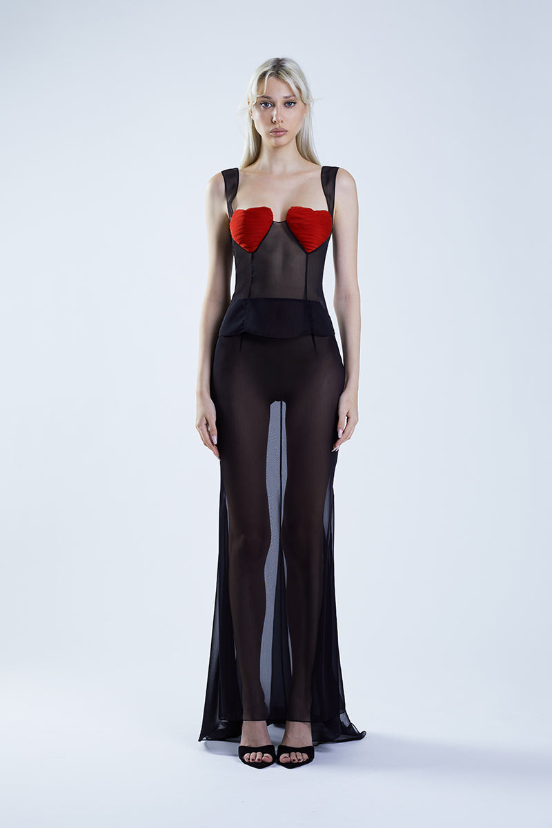 Black fishtail maxi skirt by Stolen Stores paired with a black and red bustier top, showcased on a mannequin.