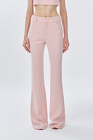 Dusty pink classic long pants by Stolen Stores, front view showing relaxed fit and subtle stitching details.