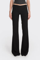 Black low waist pants by Stolen Stores, showcasing a classic style with a relaxed fit and sleek design.