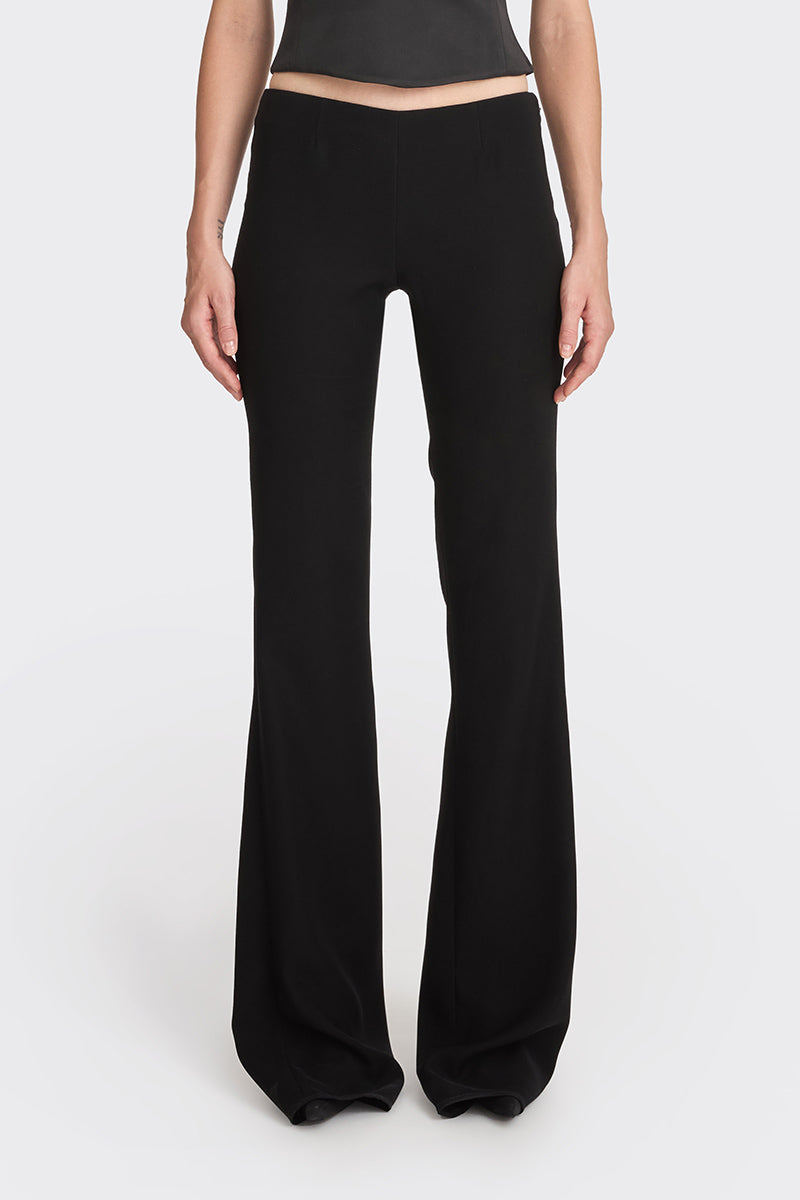 Black low waist pants by Stolen Stores, showcasing a classic style with a relaxed fit and sleek design.