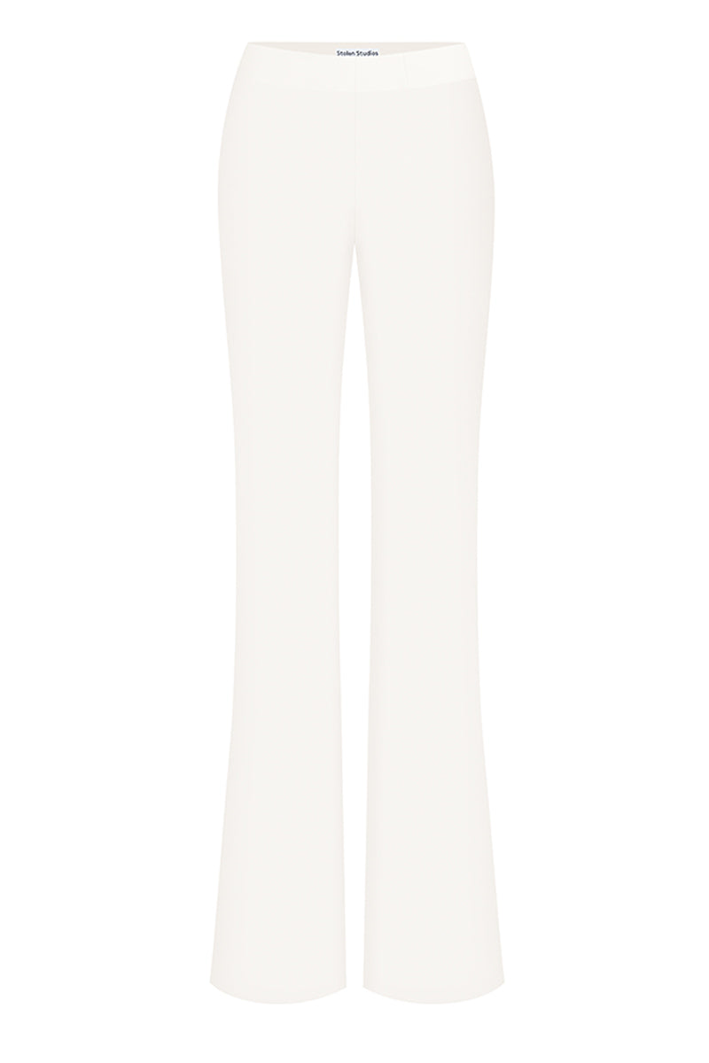 Off-white classic low waist pants by Stolen Stores, showing the relaxed fit and lightweight fabric.