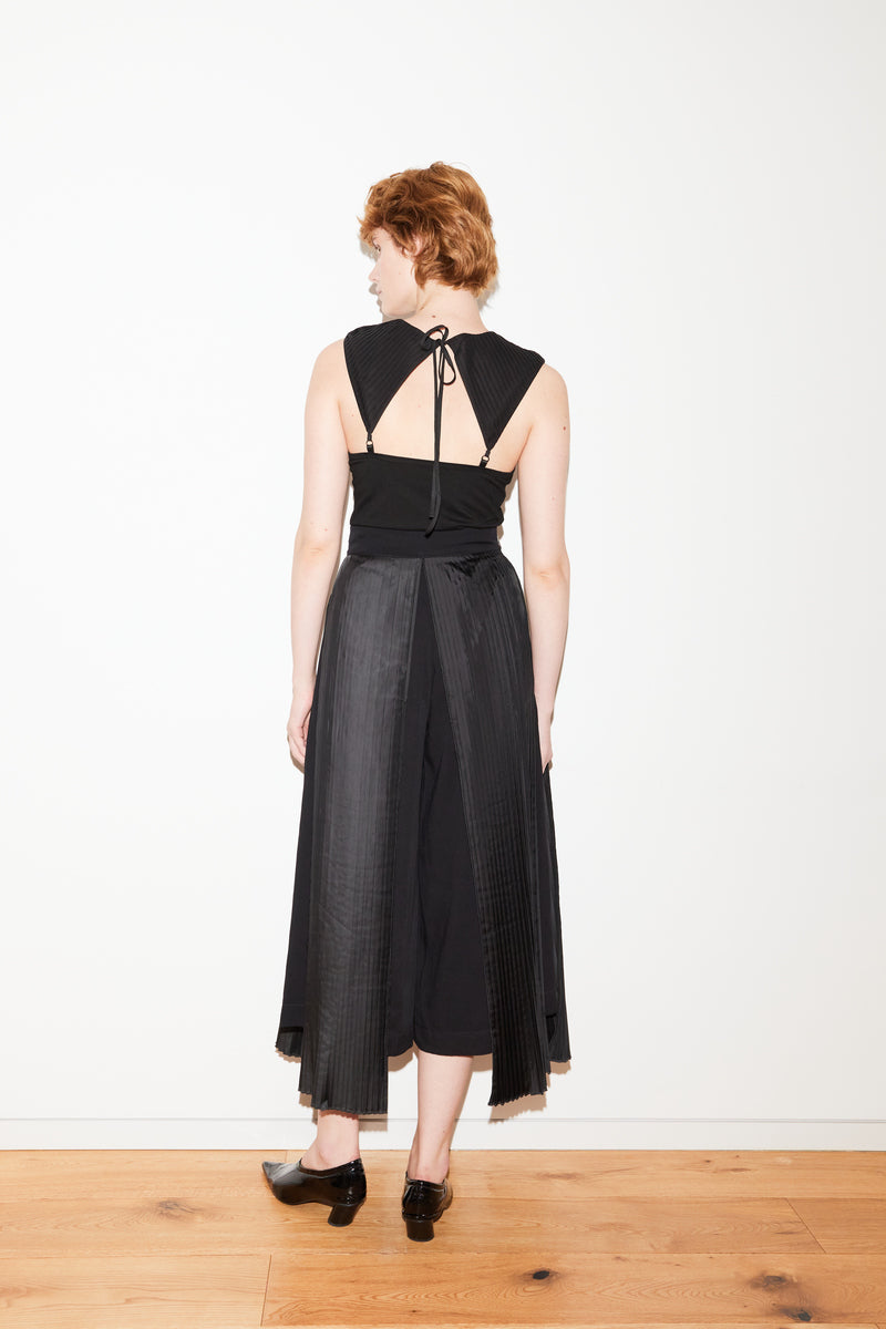 Black Claudia bodysuit by Tamar Keburia, shown on a model, featuring a fitted design and sleek neckline.