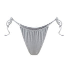 Suncillo Claudia silver gray bikini bottom with sleek, minimal design shown on a model, perfect for beach or poolwear.