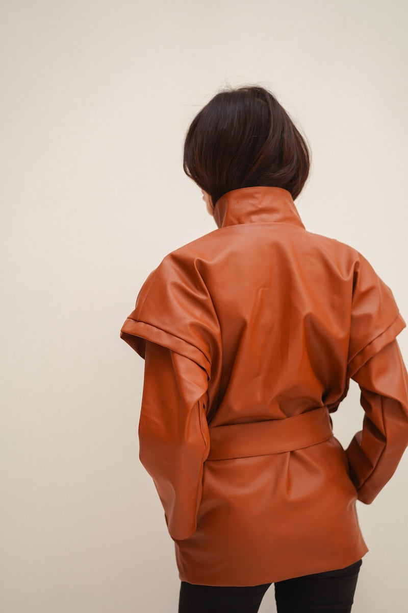 Nadya Shah Cleo faux leather belted jacket featuring a stylish design with a waist belt and classic jacket details.