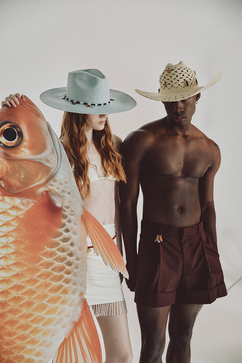 SER Clues of the Sky hat featuring a wide brim, stylish design, and sky-themed pattern for sun protection and fashion.