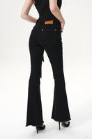 Nana Jacqueline Margaux black jeans displayed on a model, showcasing slim fit and classic denim style.