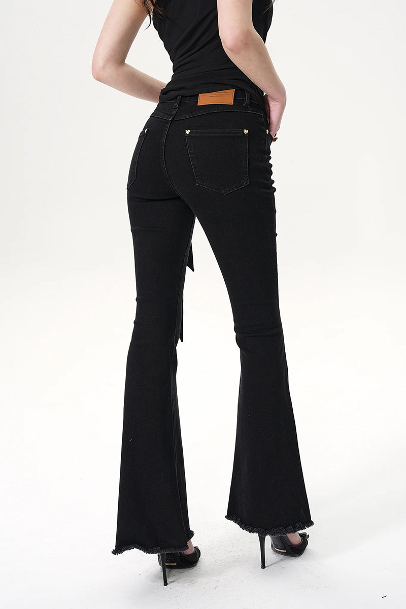 Nana Jacqueline Margaux black jeans displayed on a model, showcasing slim fit and classic denim style.