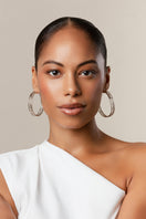 Silver Colosseo hoop earrings by Sara Shala featuring large, bold hoop design with a polished finish.