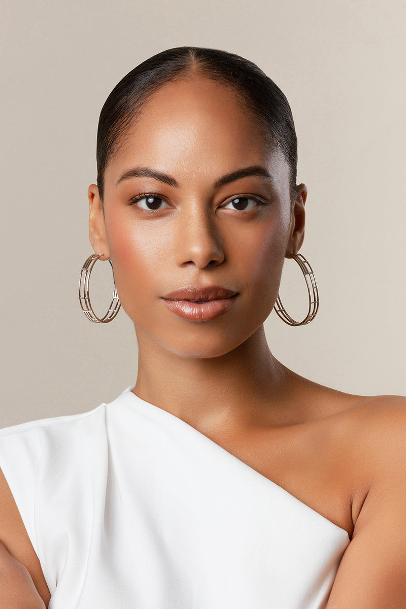 Silver Colosseo hoop earrings by Sara Shala featuring large, bold hoop design with a polished finish.