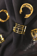 Sara Shala Colosseo yellow gold vermeil ring styled on a finger with a close-up of the ring's textured design.