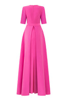 Elegant I.H.F column evening gown with elbow-length sleeves and attached mullet peplum, showcased on a model.