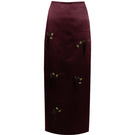 Purple YASSMIN SALEH midi column skirt with a sleek, fitted design, shown from the front in a stylish silhouette.