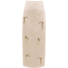 White Yassmin Saleh column midi skirt with a sleek, fitted design, shown from the front on a ghost mannequin.
