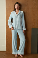 Blue velvet women's pajama set by MANITO, featuring a comfortable, cozy design perfect for relaxing evenings.