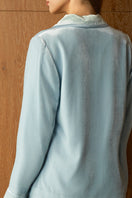 Blue velvet women's pajama set by MANITO, featuring a cozy top and matching pants, perfect for comfortable lounging.