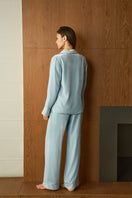 Blue women's velvet pajama set by MANITO featuring long sleeves and relaxed fit, perfect for cozy nights.