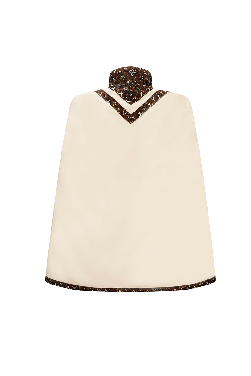 Nadya Shah Balthazar Cape jacket featuring a stylish, flowing design with detailed fabric and elegant silhouette.