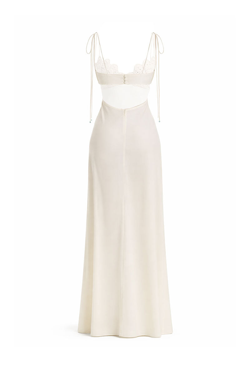 Off-white Concha Dress gown by Maylé Vásquez featuring elegant fabric and flowing design, perfect for formal occasions.