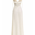 Off-white Concha dress gown by Maylé Vásquez featuring elegant fabric and flowing silhouette for formal occasions.