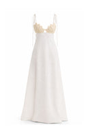 Off-white Conchita dress by Maylé Vásquez, elegant gown with flowing fabric and detailed design, perfect for formal occasions.