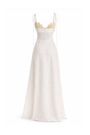 Off-white Conchita gown by Maylé Vásquez with intricate lace details and flowing fabric, elegant evening dress for formal occasions