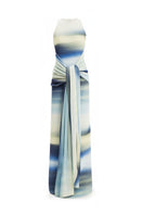 Maylé Vásquez Consta Maxi Dress with blue wave print, flowing fabric, and elegant design perfect for summer or casual wear.