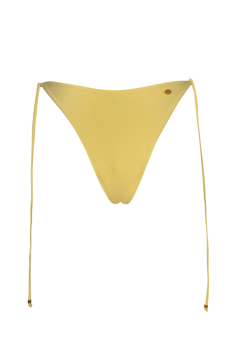 Baobab Itala bikini bottom in butter color, with a smooth fit and stylish design, shown on a model.