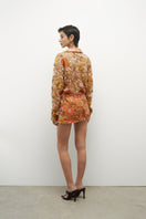 Embroidery low waist mini skirt by JC Pajares featuring detailed embroidery and a stylish short length.