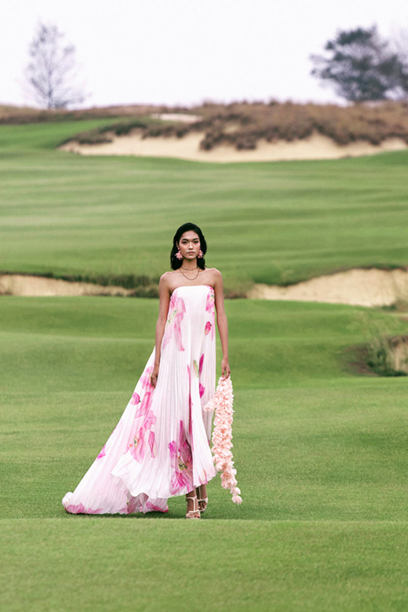 Valenciani Cult Mia X Valenciani Blossom pleated maxi dress featuring a flowing design and floral pattern.