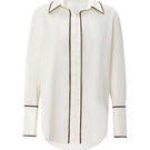 White boyfriend shirt by IKINITA, featuring a classic button-up design, displayed flat on a neutral background.