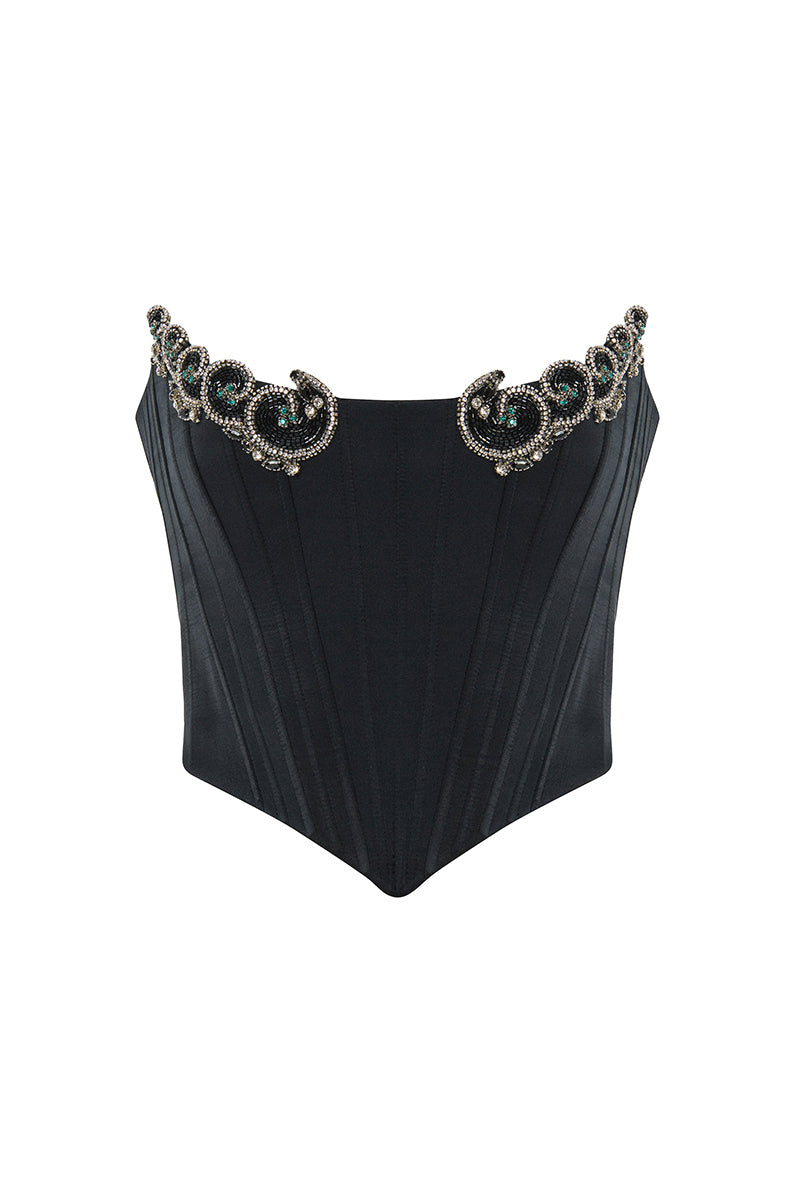Black IKINITA Wave Corset top featuring structured design and adjustable straps, styled for a trendy, fitted look.