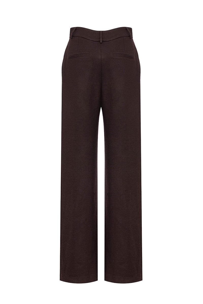 Brown IKINITA Moon Pants laid flat, showing their relaxed fit and soft fabric, perfect for casual wear.