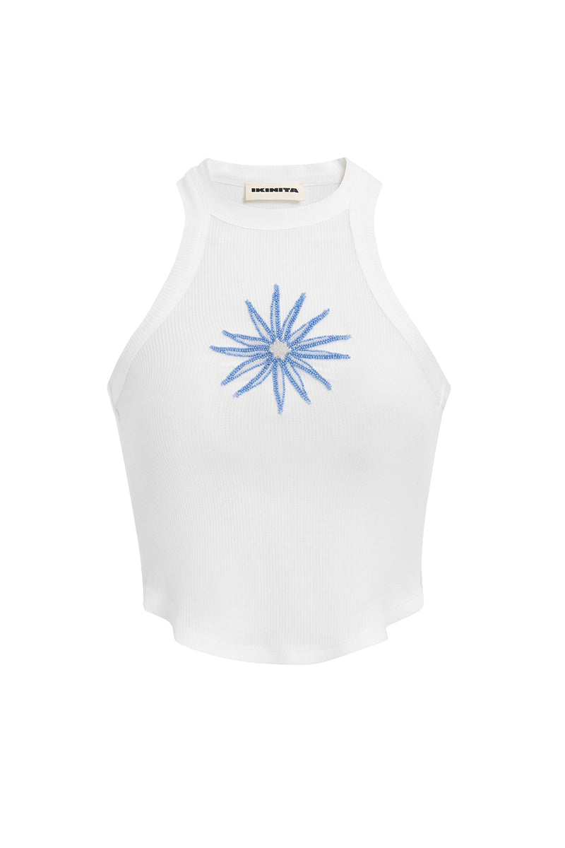 White and blue IKINITA Water Top, stylish casual top with graphic design, displayed on a plain background.