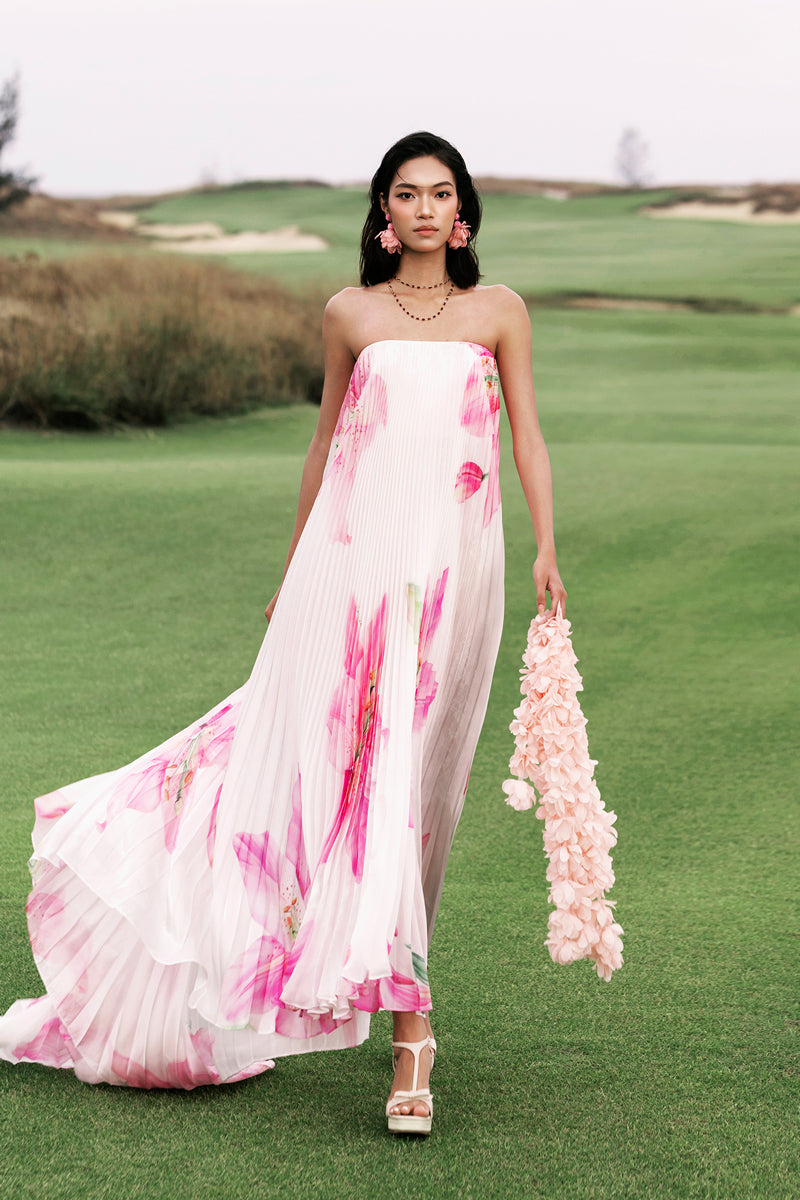 Valenciani CULT MIA X VALENCIANI Blossom pleated maxi dress with flowing fabric and floral design, perfect for elegant occasions.