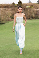 Sky blue balloon pants by Valenciani featuring a loose, relaxed fit and soft fabric, shown on a model.