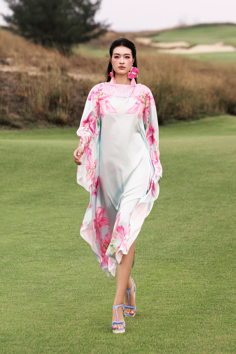 Colorful Valenciani Oasis Maxi Kaftan featuring vibrant multicolor patterns and flowing fabric, perfect for elegant summer wear.