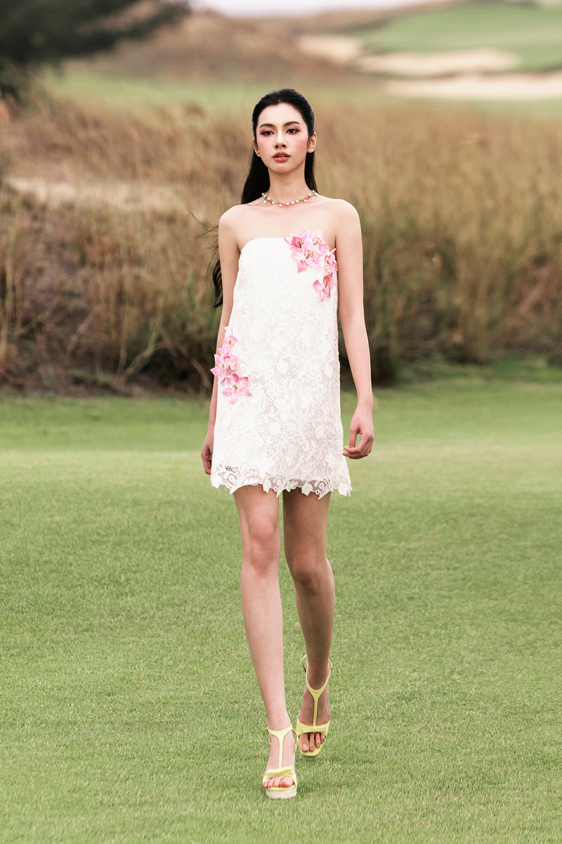 White strapless mini lace dress by Valenciani, featuring delicate lace details and a fitted silhouette, perfect for stylish occasions.